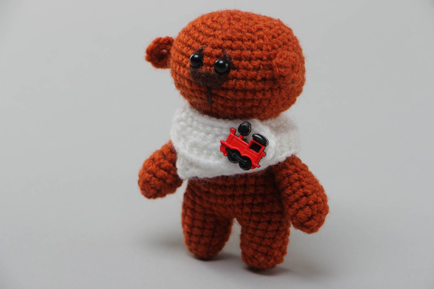 Soft handmade crocheted toy bear in brown with a small collar present for baby photo 2