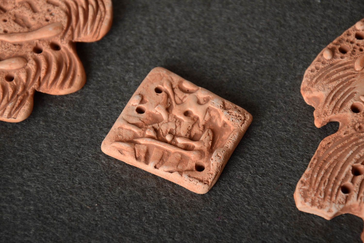 Handmade ceramic jewelry finding of square shape of beige color with openings photo 1