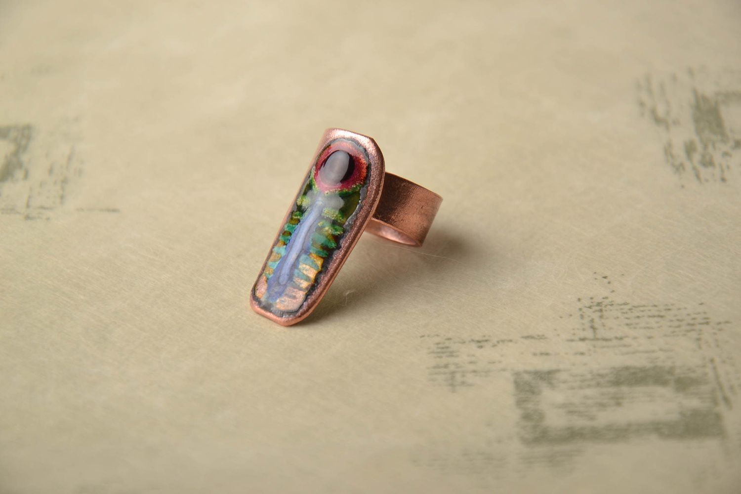 Copper ring with unusual ornament painted with enamels photo 1