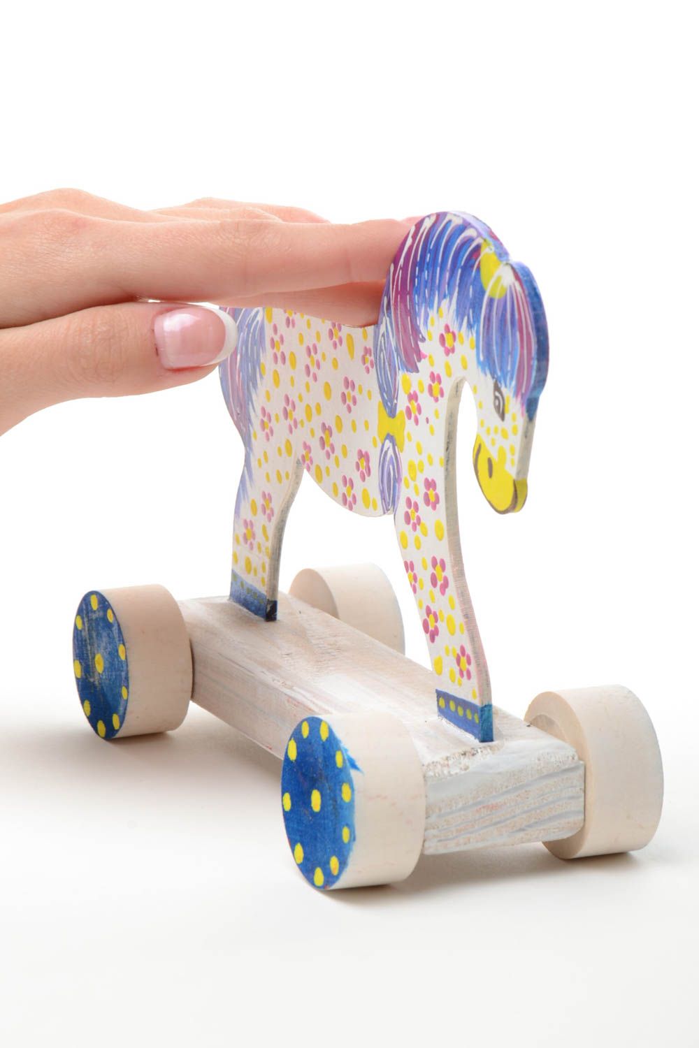 Bright painted handmade wooden wheeled toy of light color Horse for children photo 4