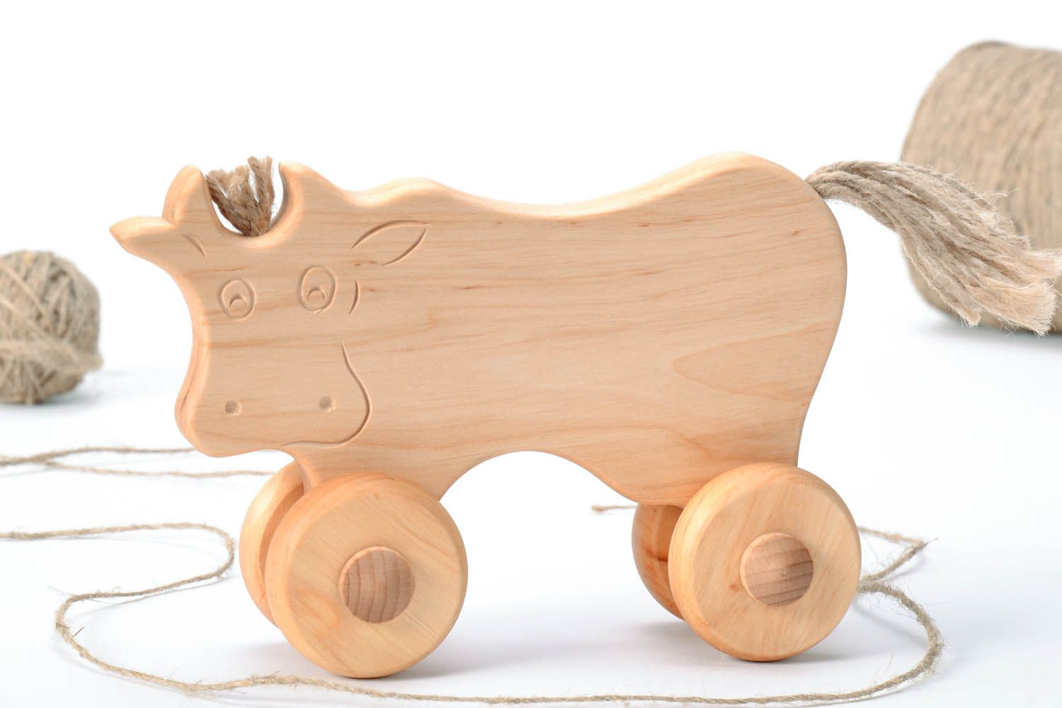 Wooden cow with wheels photo 1