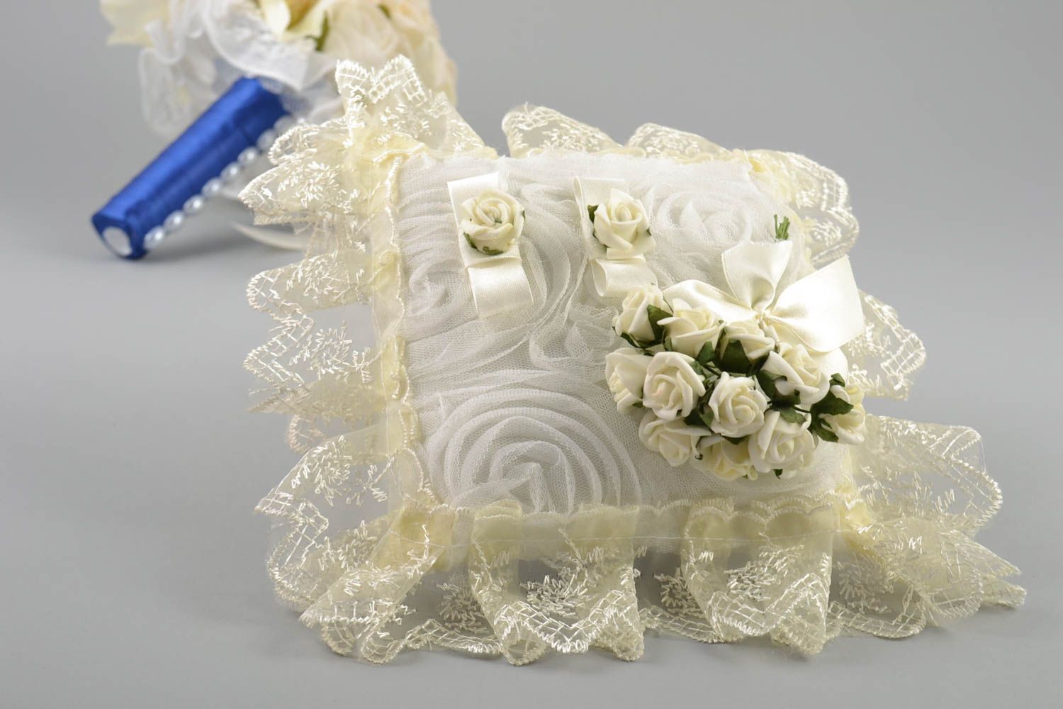 Handmade decorative fabric ring pillow with cream lace and artificial flowers photo 1