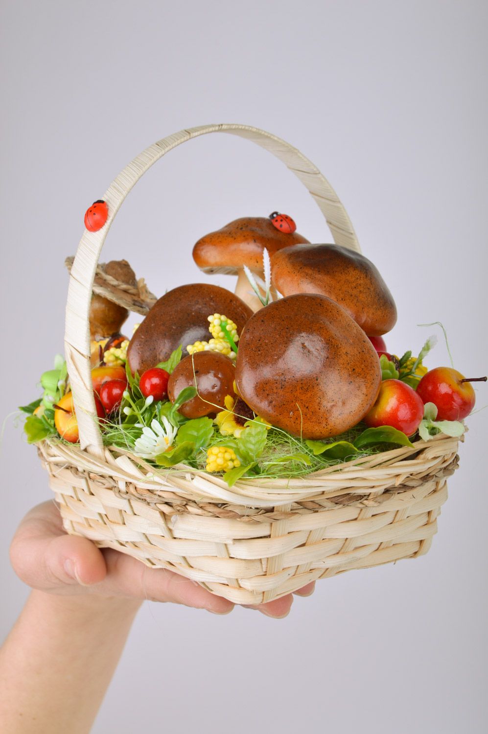 Handmade decorative sisal basket with fruit and mushrooms and frog figurine interior composition photo 3