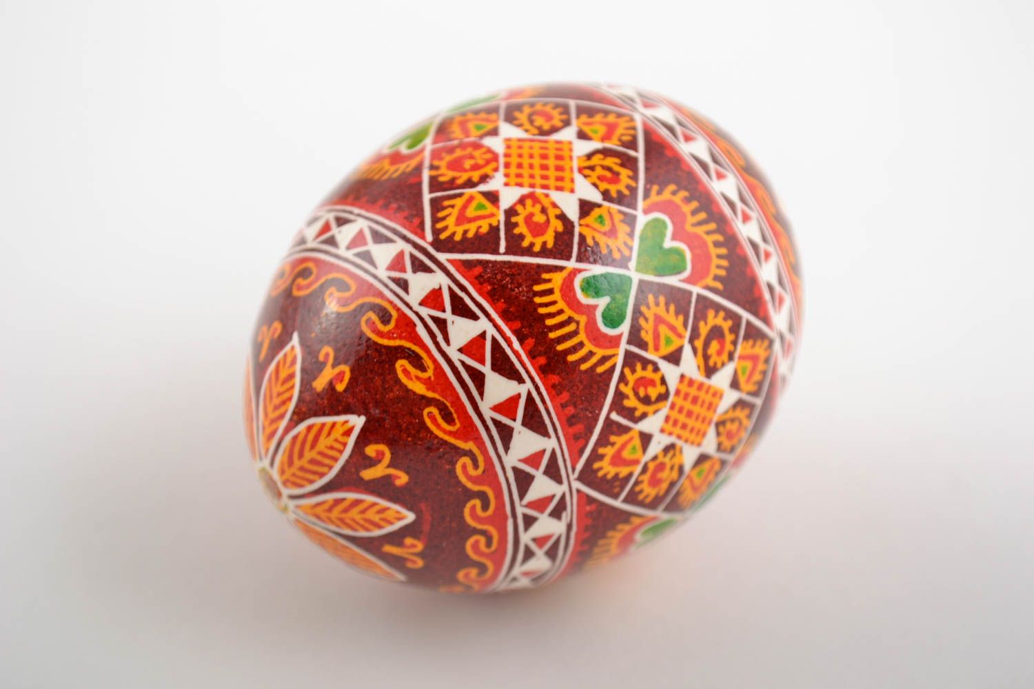 Decorative handmade painted Easter egg with ornament in red color palette photo 4