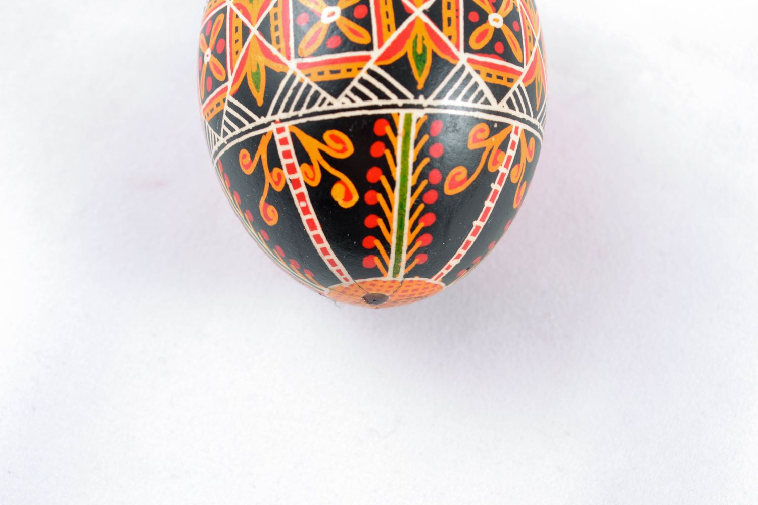 Painted chicken egg for Easter of black color with ornament photo 5
