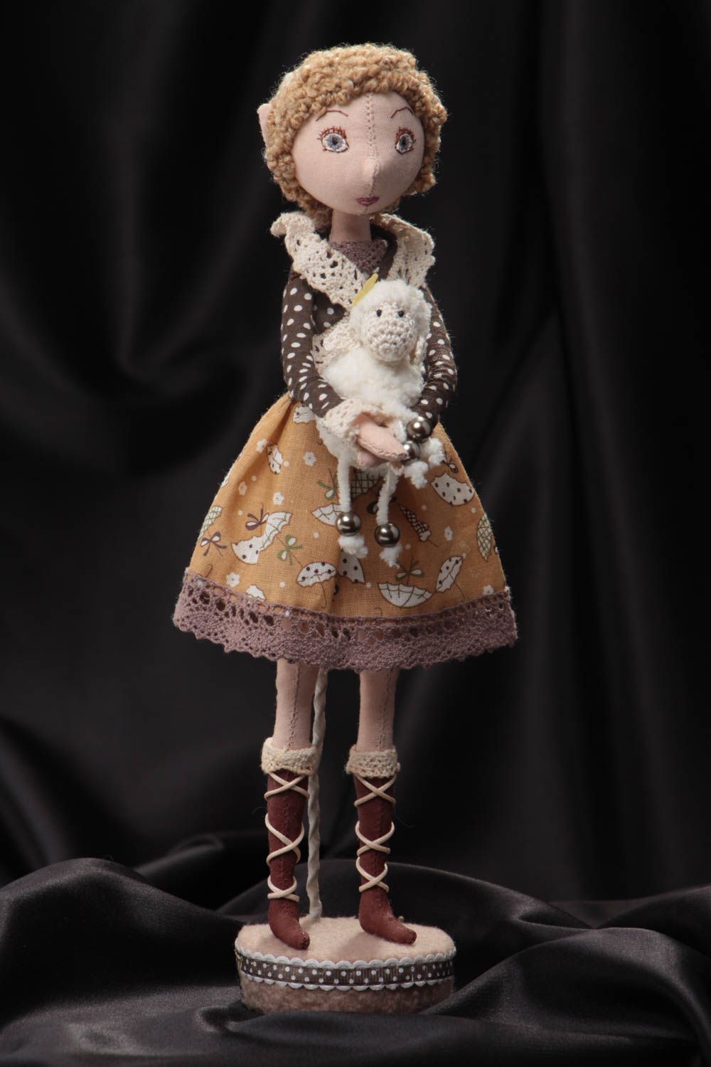 Handmade designer fabric soft doll in brown dress with toy lamb on stand photo 1