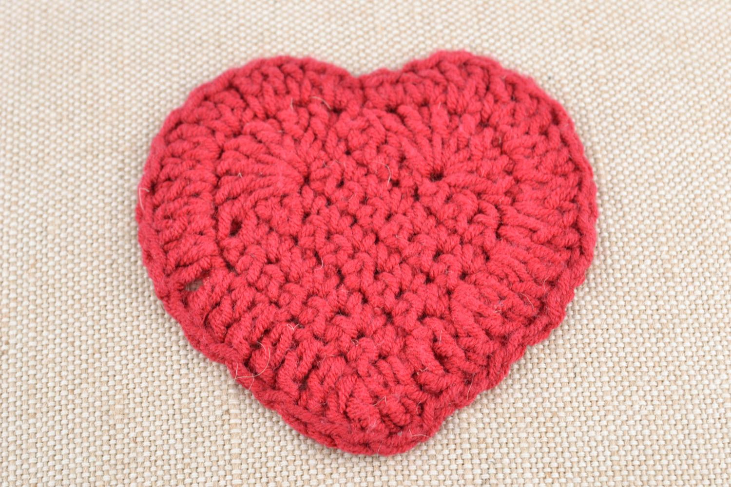 Soft cushion with crochet hearts photo 3