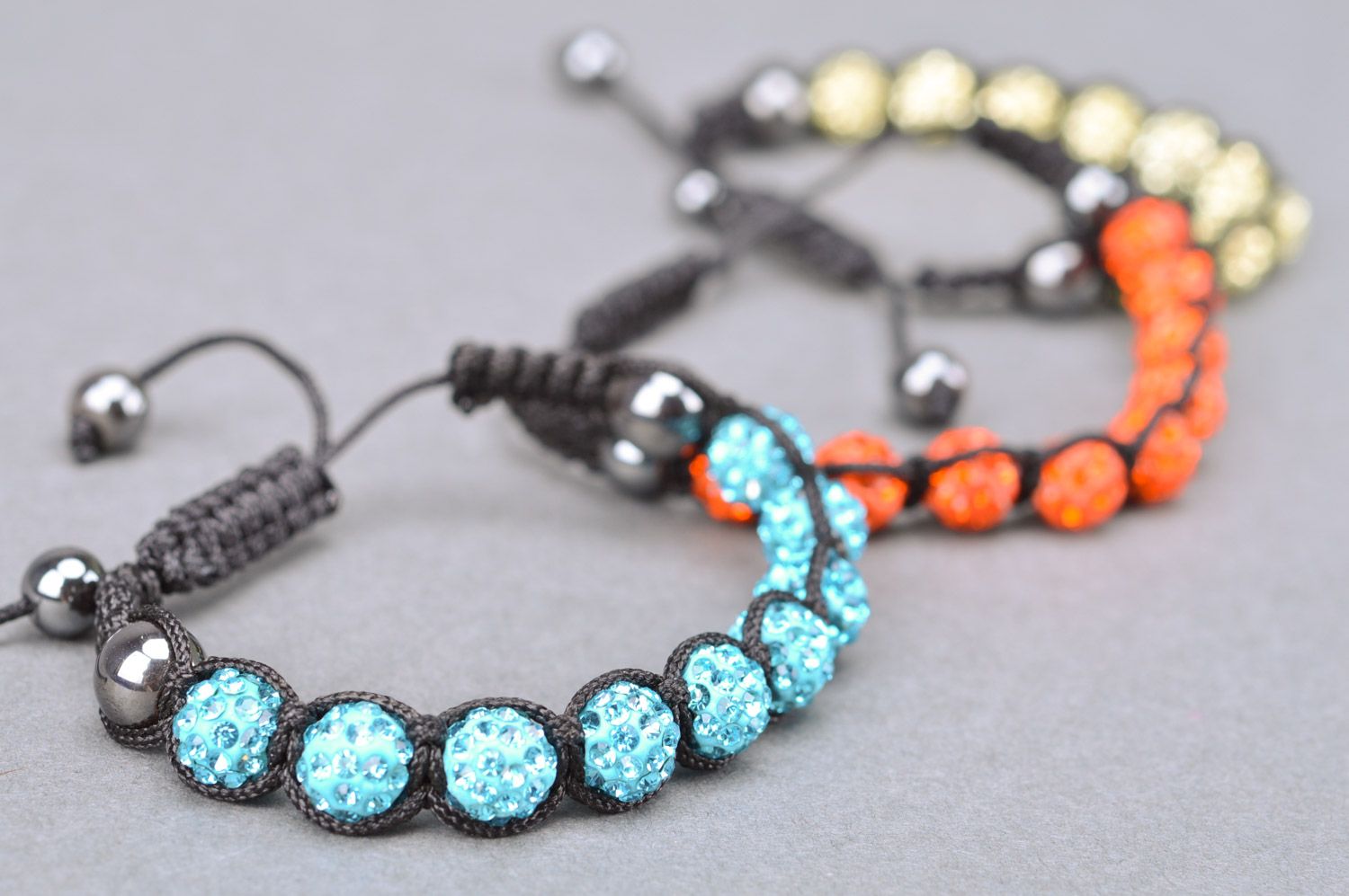 Set of beautiful designer handmade women's wrist bracelets woven of threads and beads 3 items photo 2