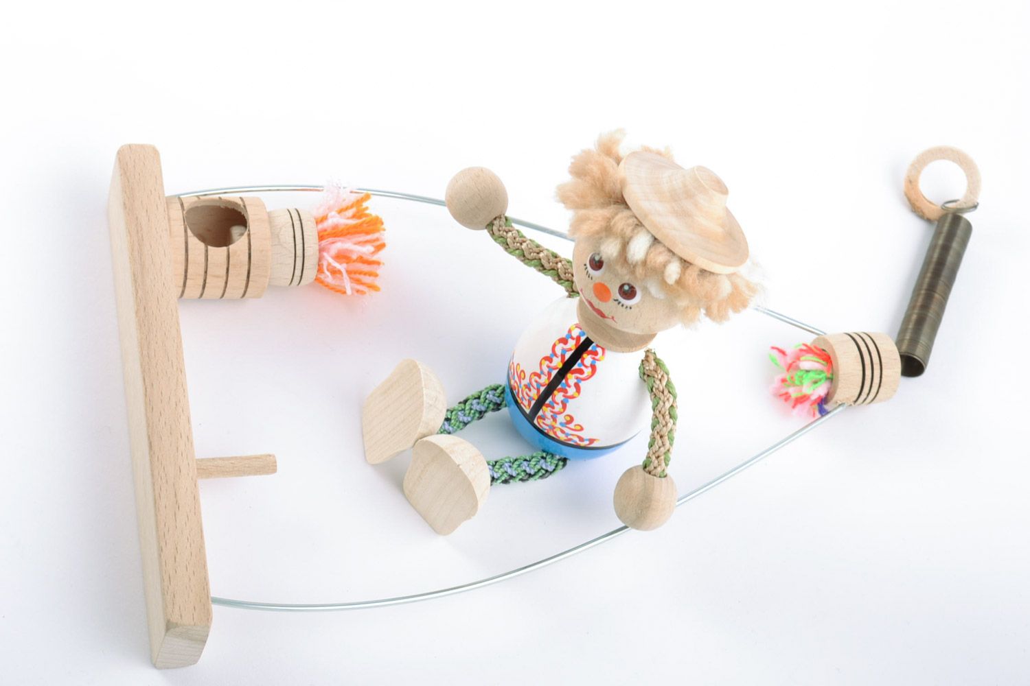Деревянная игрушка мальчик на качелях с росписью ручной работы авторская фото 5