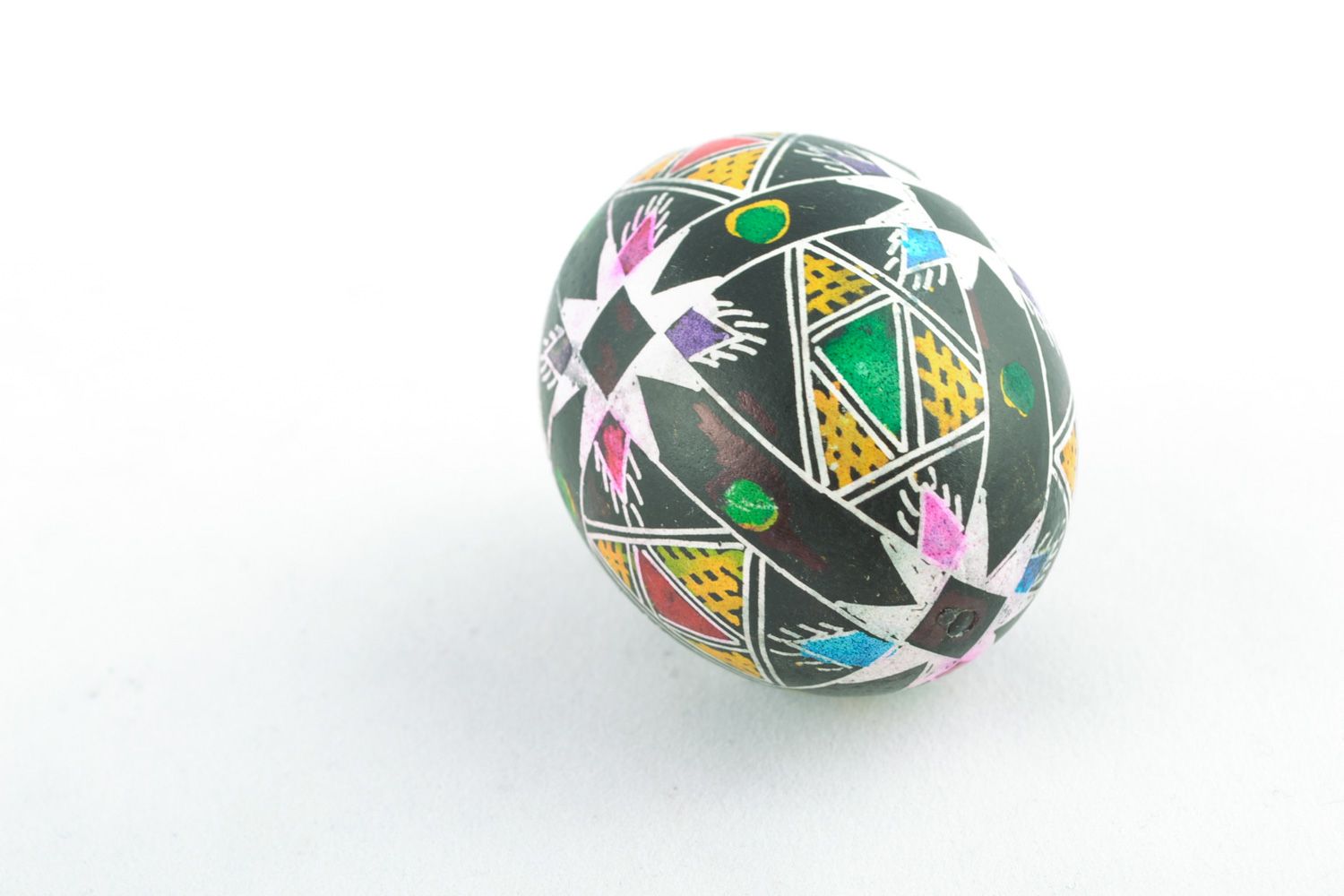 Handmade Easter egg with contrast geometric ornament painted using wax technique photo 3