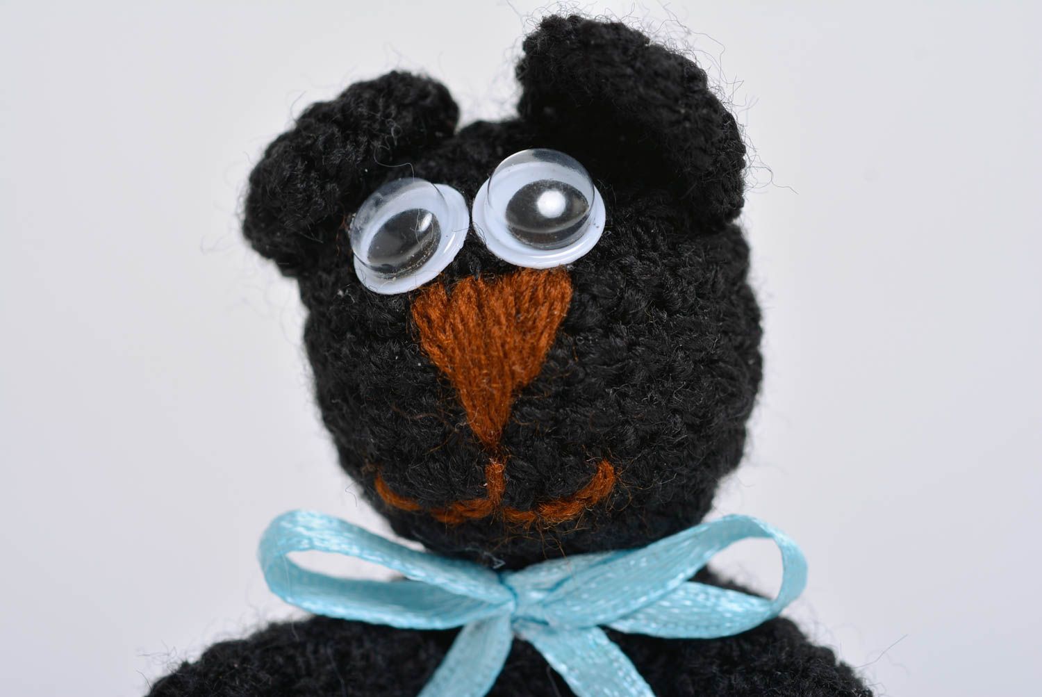 Small black children's handmade soft toy kitty crocheted of acrylic threads photo 2