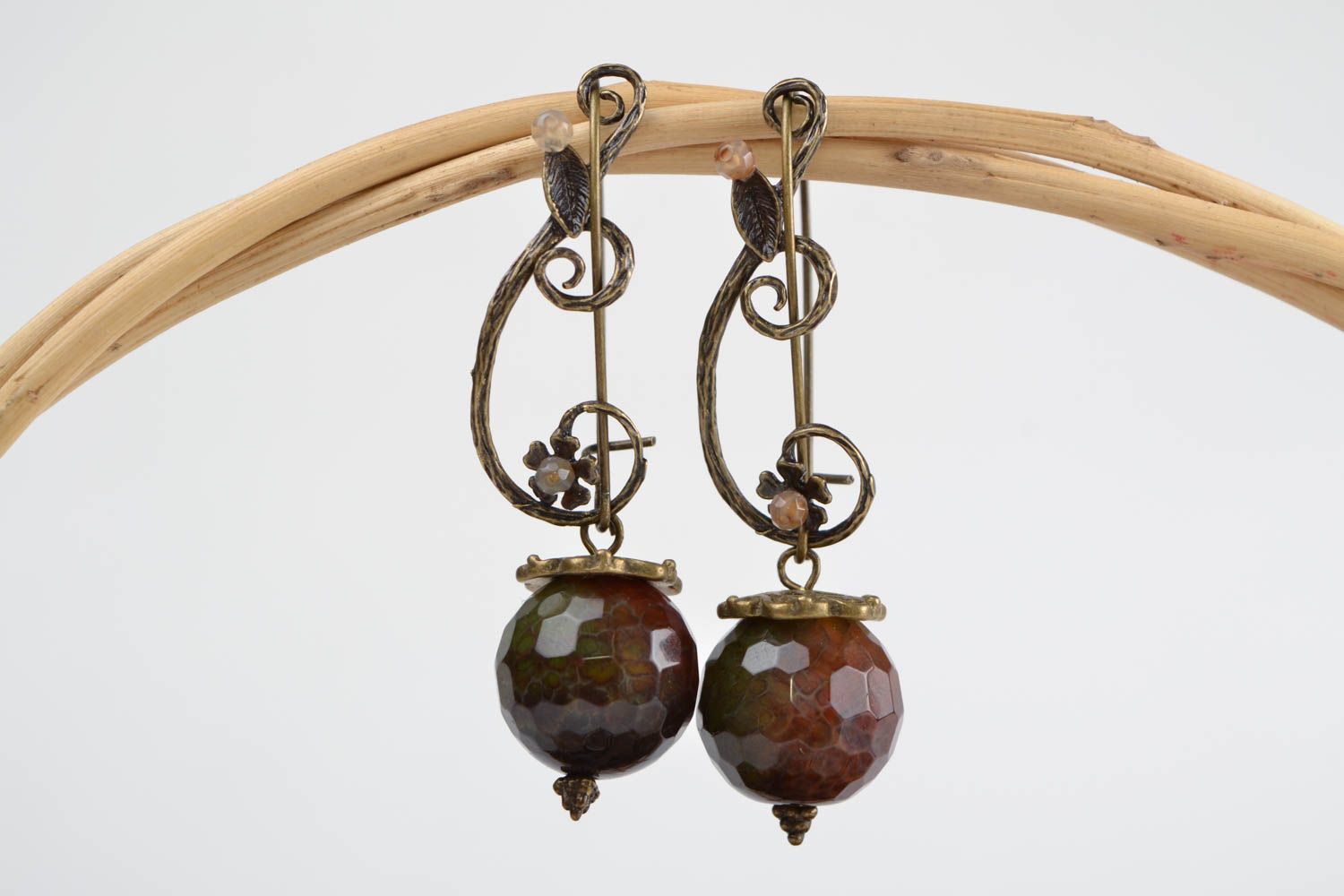 Handmade dangling earrings with fancy metal fittings and snake agate stone beads photo 1