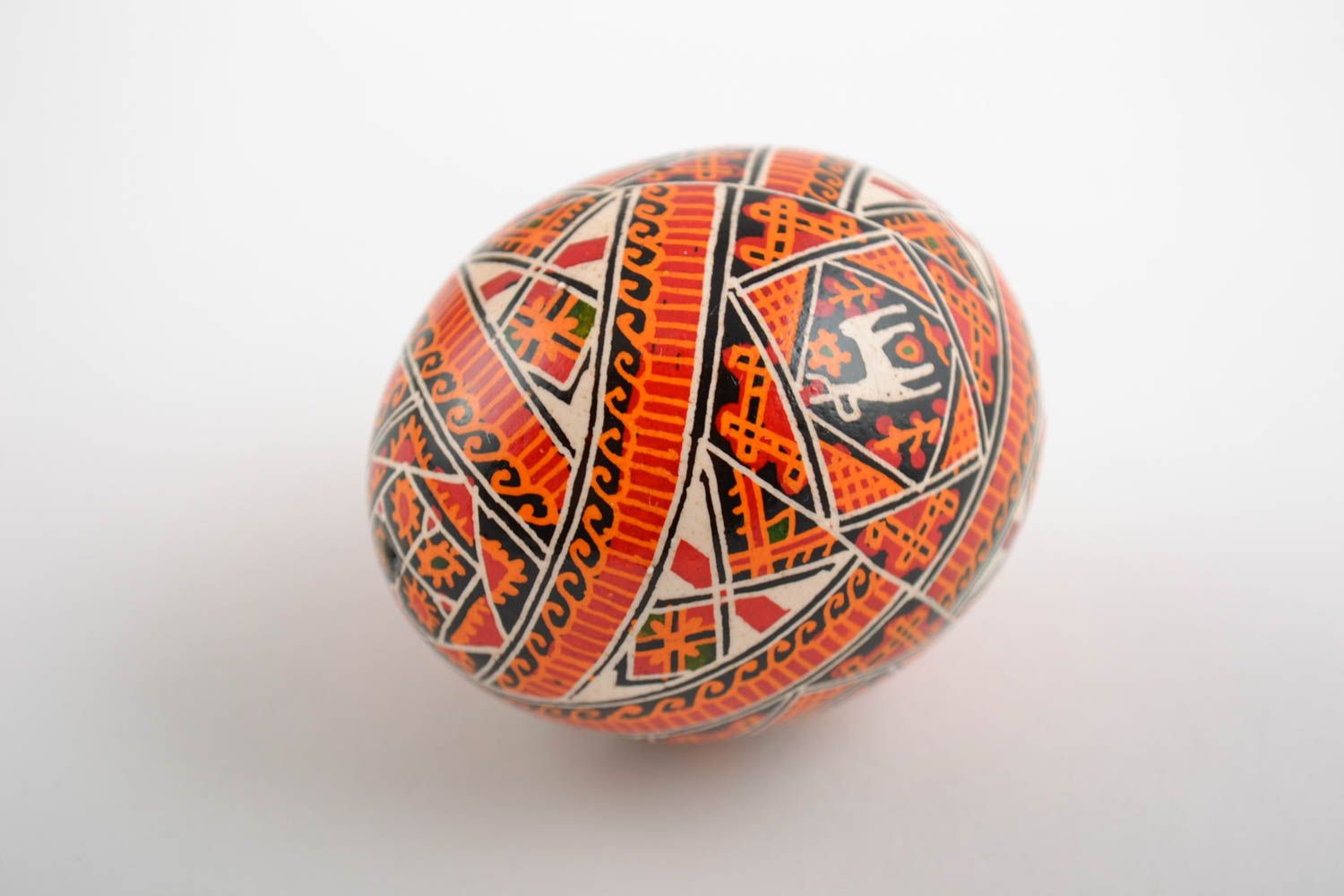 Beautiful handmade painted orange Easter egg with Slavic symbolics photo 4