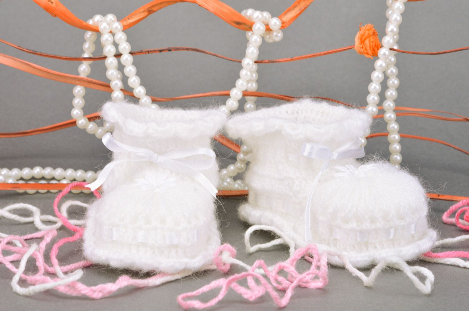 Handmade crocheted white baby booties for girl made of acrylic yarn with ribbon photo 1