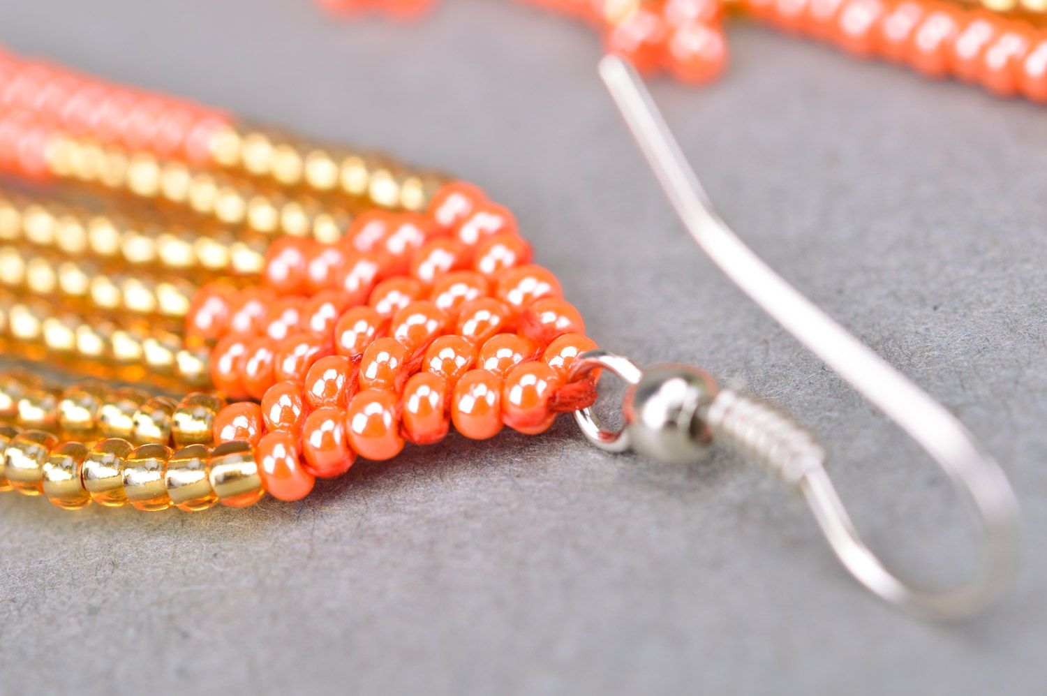 Stylish long handmade beaded earrings with fringe of golden and red colors photo 4