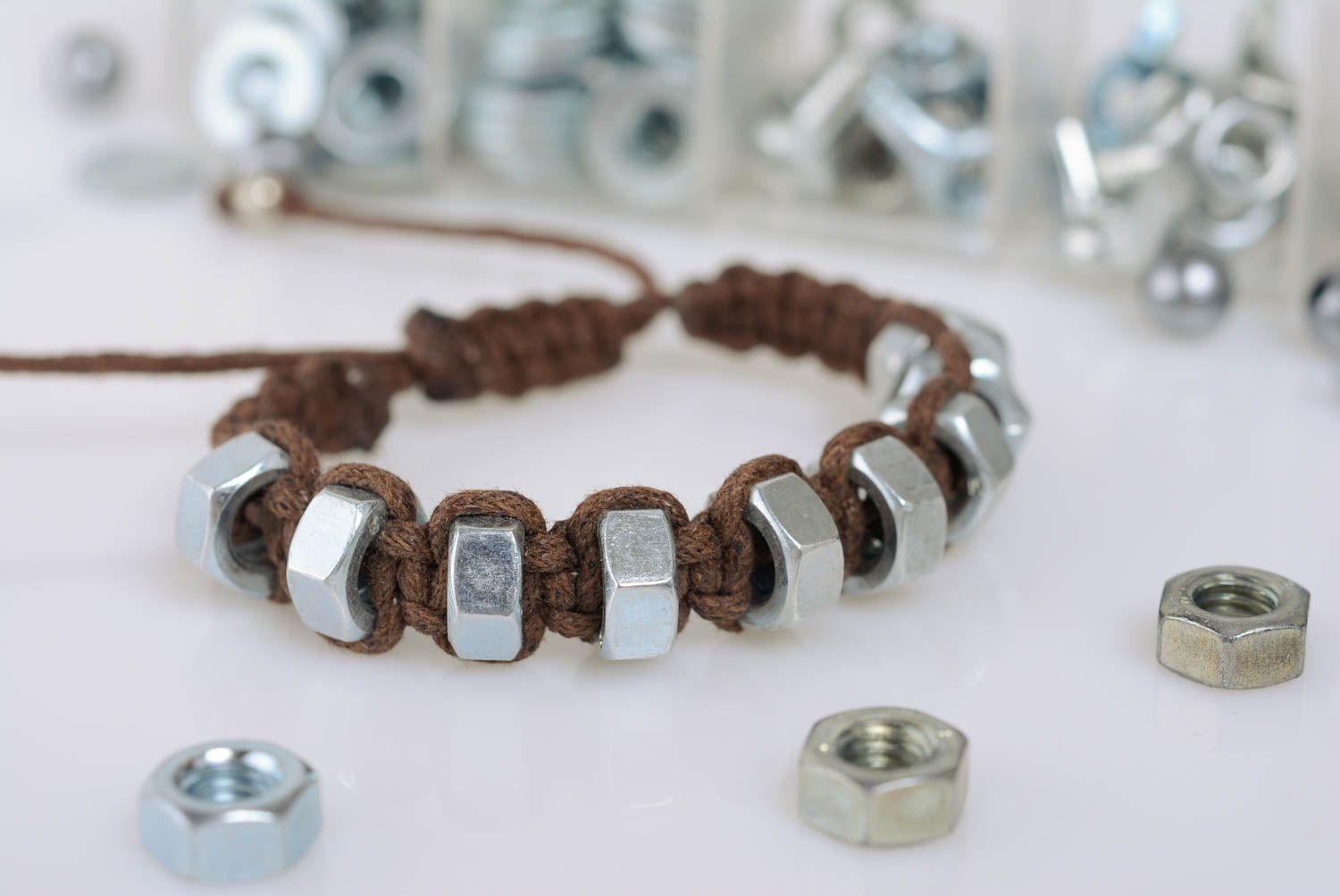 Handmade brown macrame woven cord bracelet with stainless steel nuts photo 1