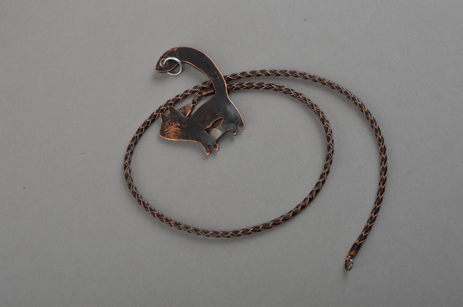 Unusual pendant made of copper using forging technique on lace in shape of cat photo 2