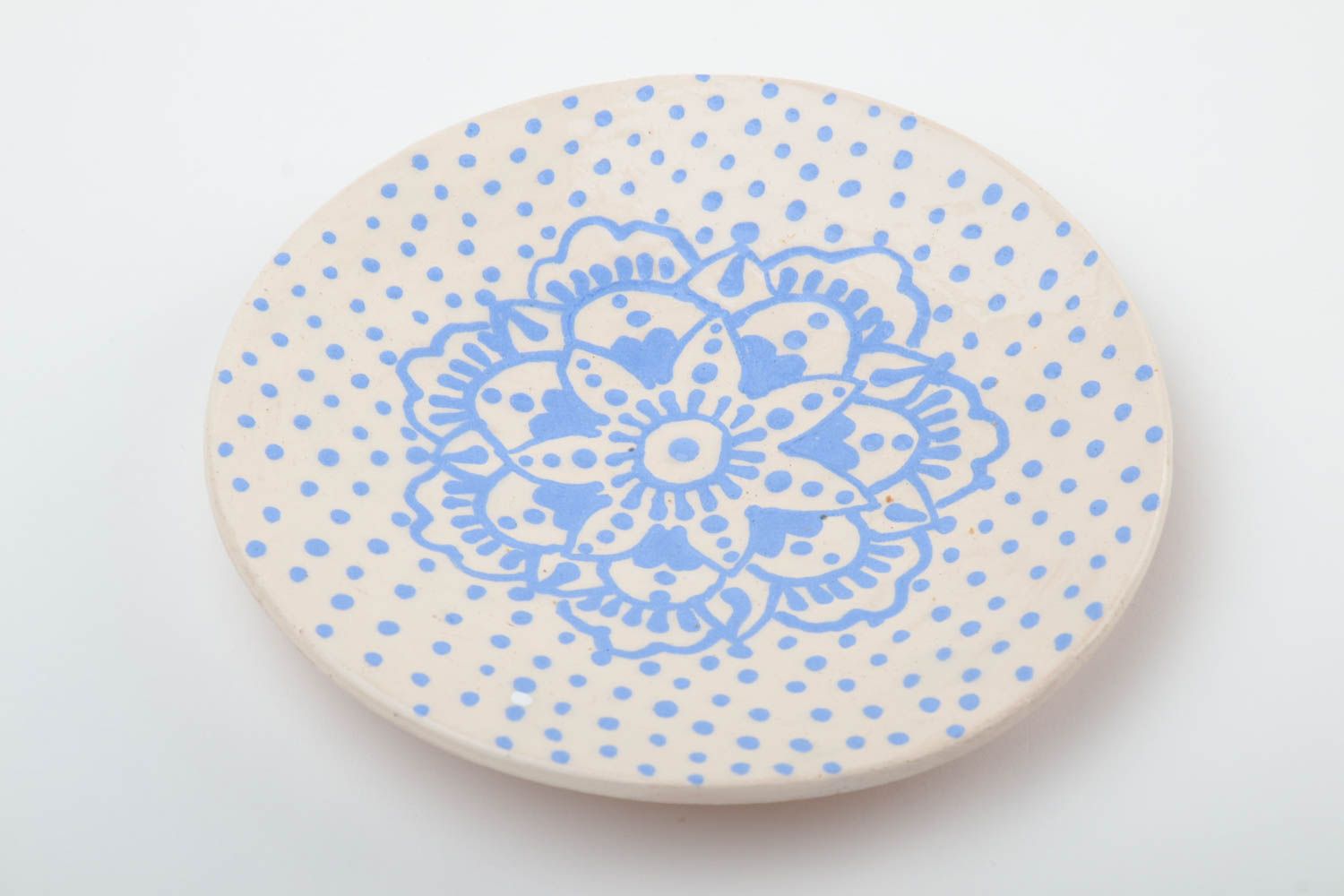 Handmade decorative small glazed white ceramic saucer with blue ornaments photo 2
