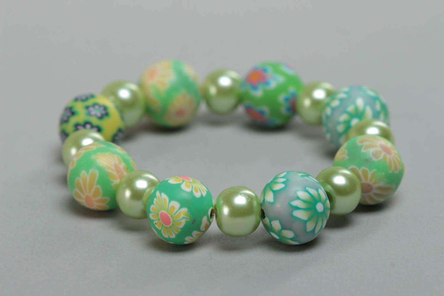 Beautiful children's handmade polymer clay wrist bracelet of green color photo 4