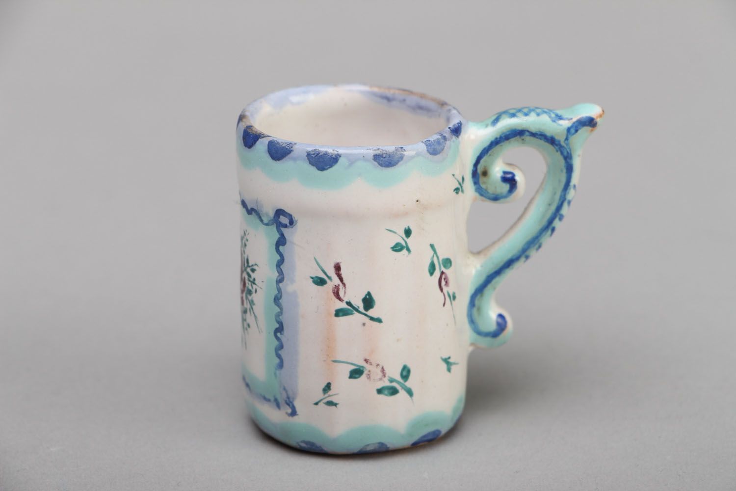 Tiny decorative ceramic cup for table or shelf decor photo 1