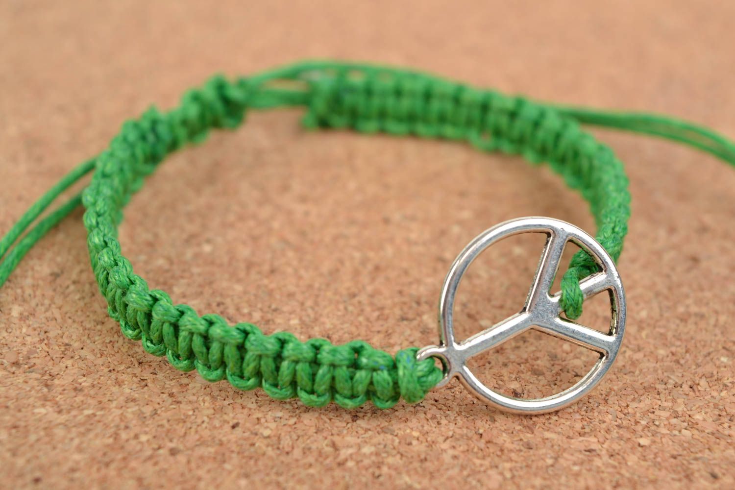 Green handmade woven cotton cord wrist bracelet with metal charm photo 1
