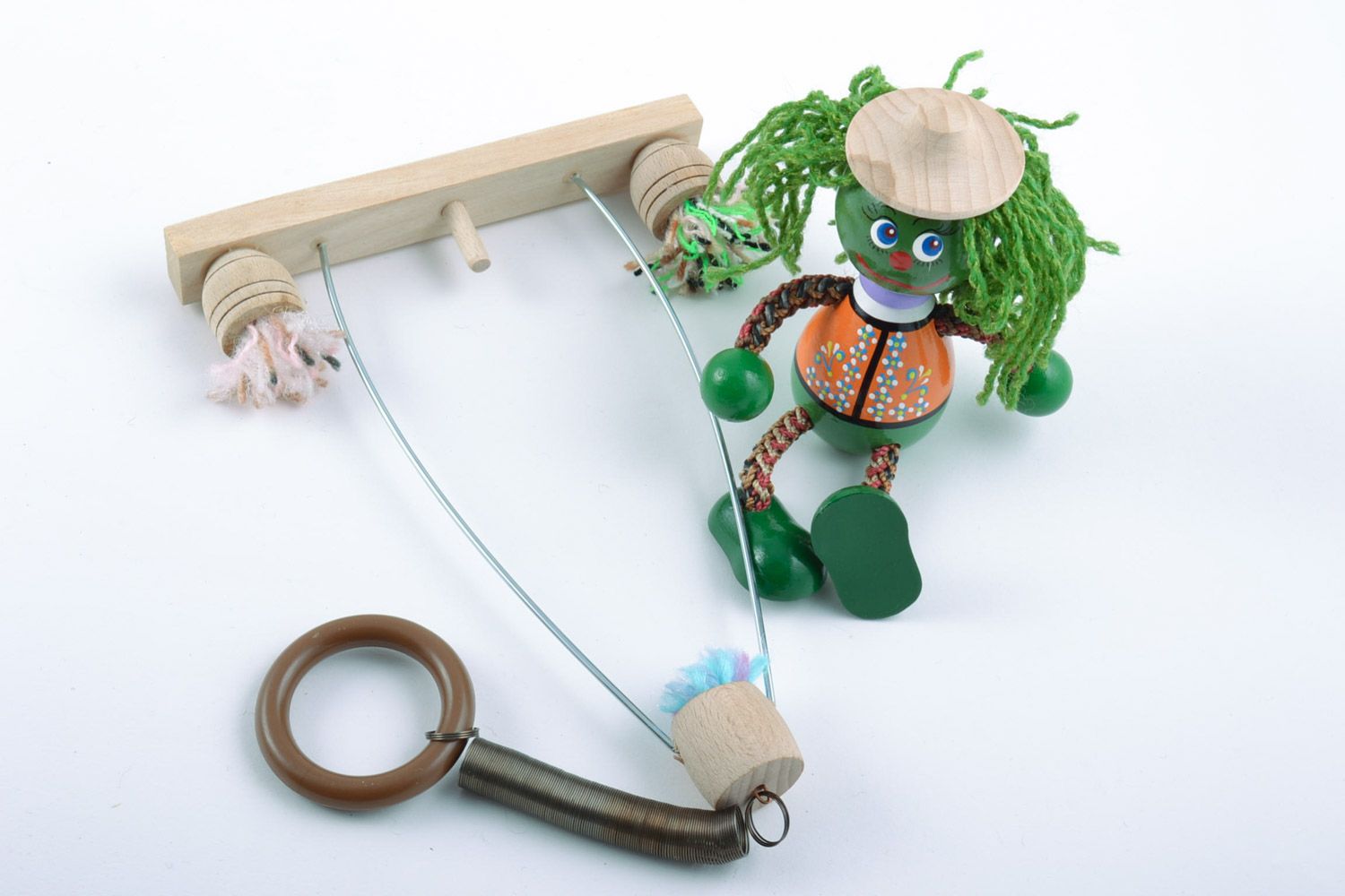 Handmade small painted wooden eco toy in the shape of merman sitting on swing photo 5