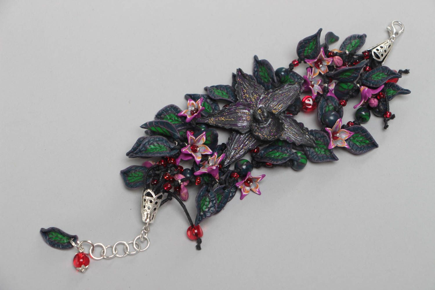 Handmade stylish bracelet made of polymer clay with black orchids on chain photo 1