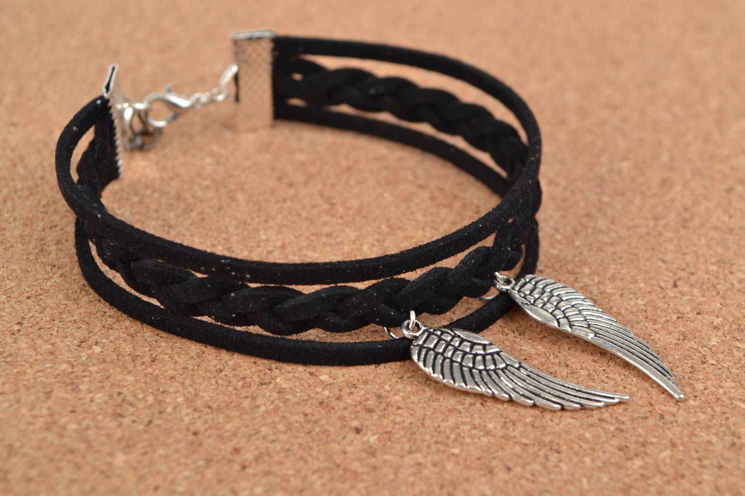 Stylish black handmade suede cord bracelet with metal charms in the shape of wings photo 1