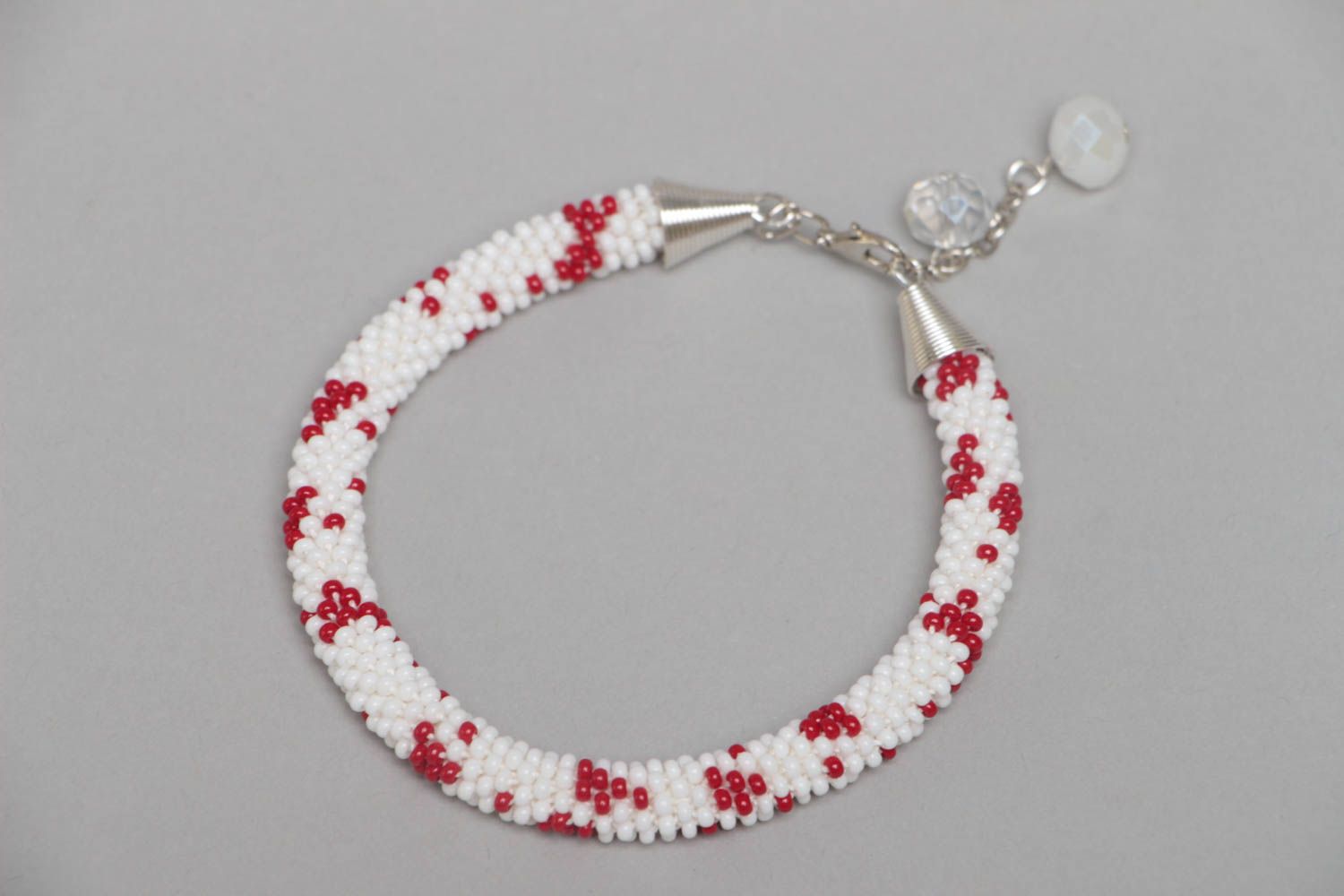 Handmade designer white and red beaded cord women's wrist bracelet with charms  photo 2