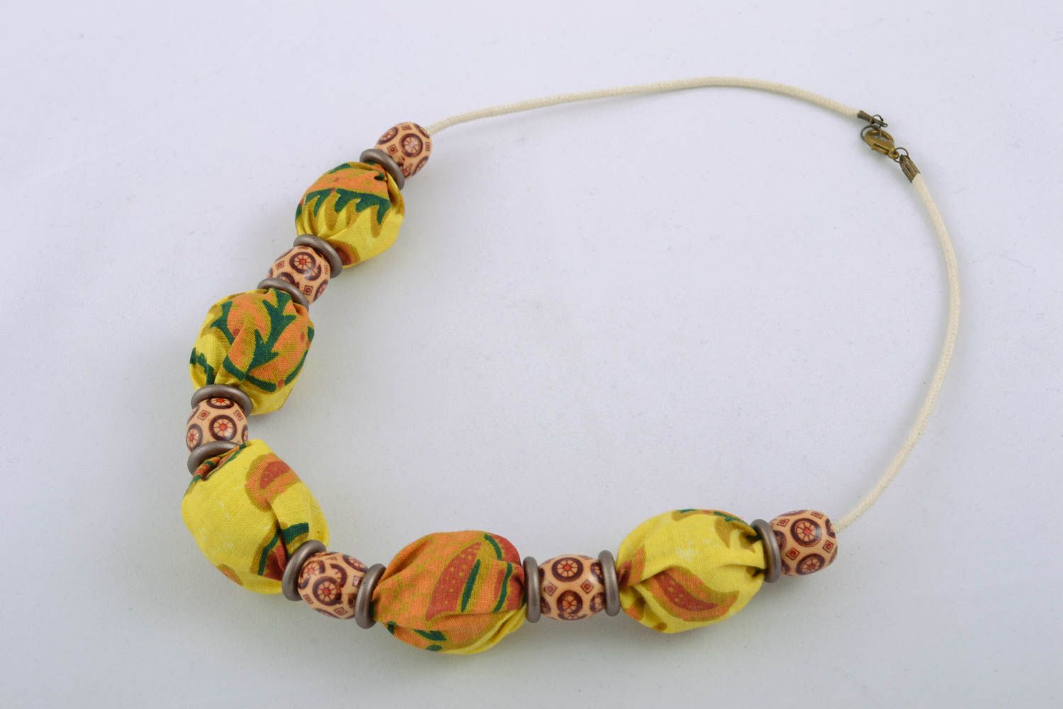 Textile necklace with wooden beads and nuts photo 1