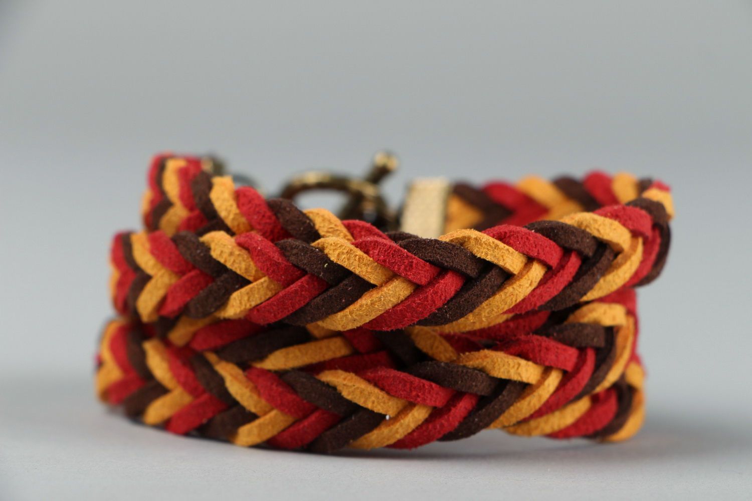 Braided suede bracelet of red and brown colors photo 3