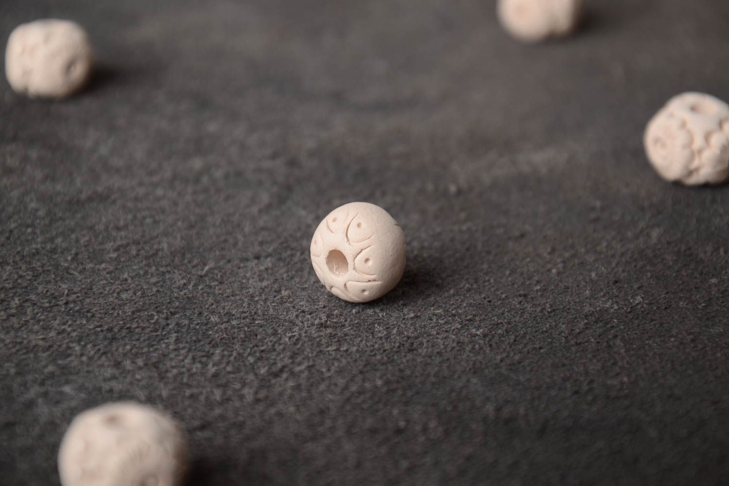 Unusual handmade round white clay bead with pattern  photo 1