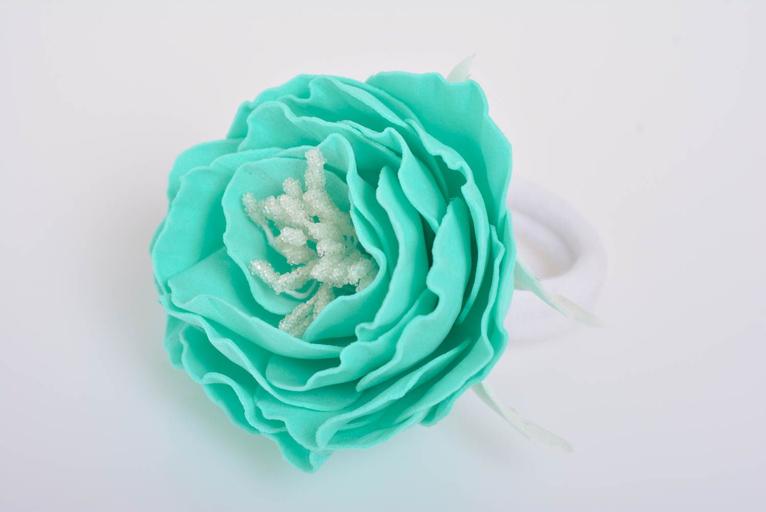 Handmade decorative hair band with large volume foamiran flower of mint color photo 1