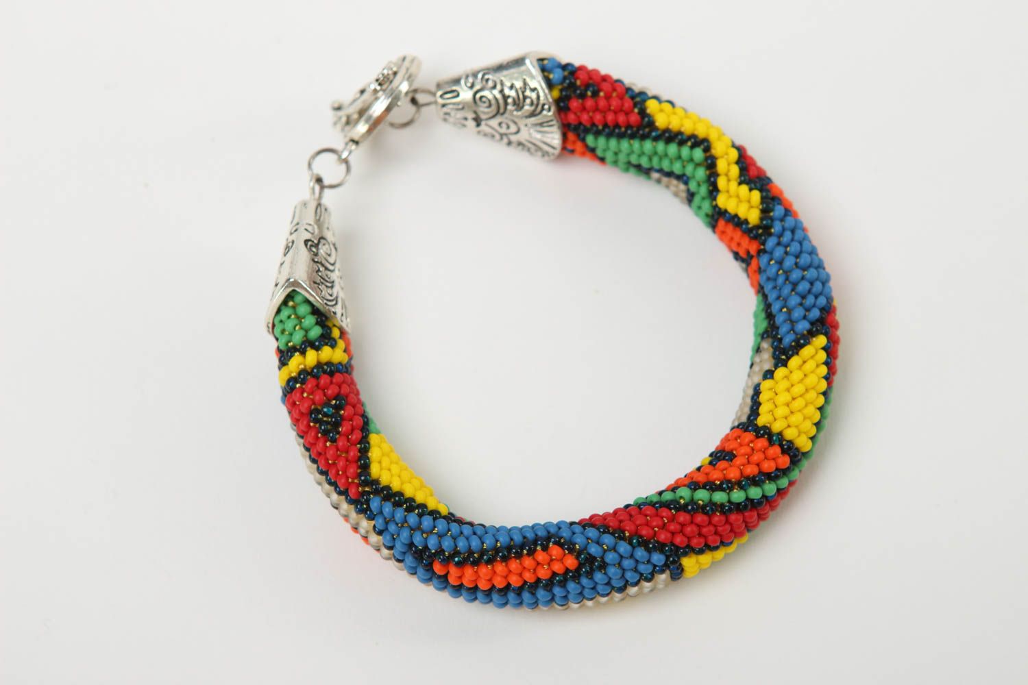 Handmade beaded cord bracelet in geometric style and metal fittings photo 2