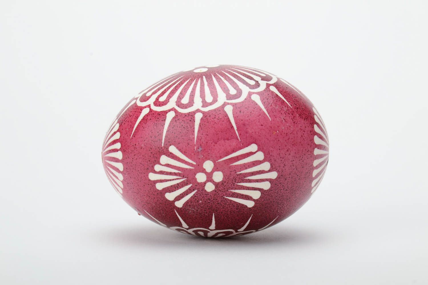 Red and white handmade designer painted Easter egg ornamented using waxing technique photo 3