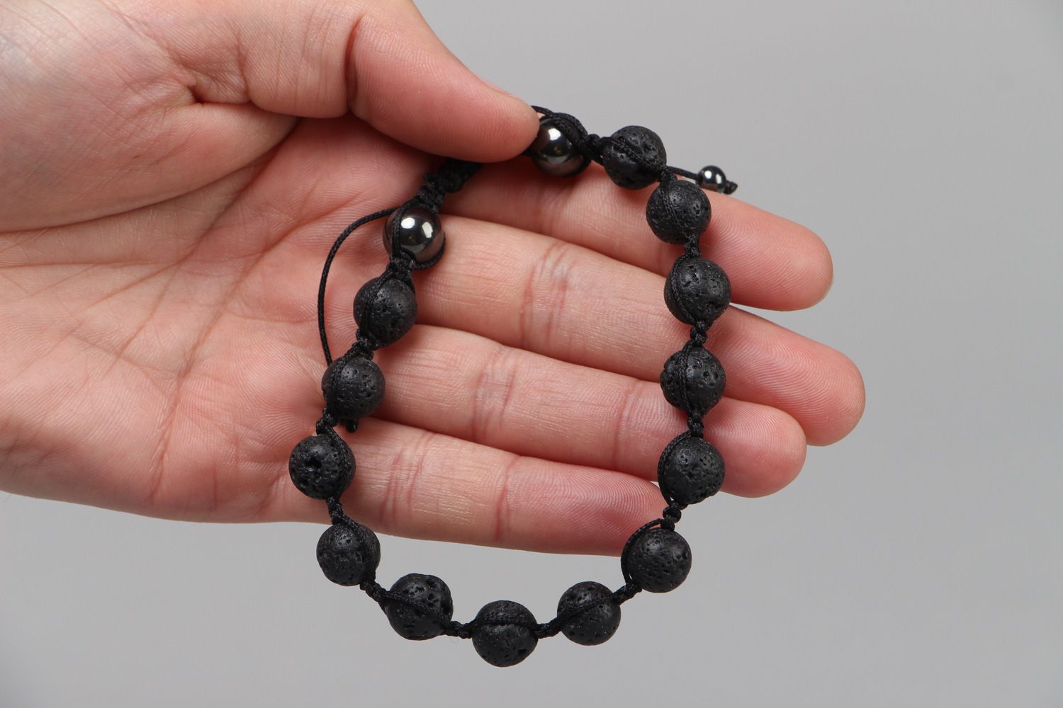 Handmade wrist bracelet with volcanic lava and hematite beads with adjustable size photo 3