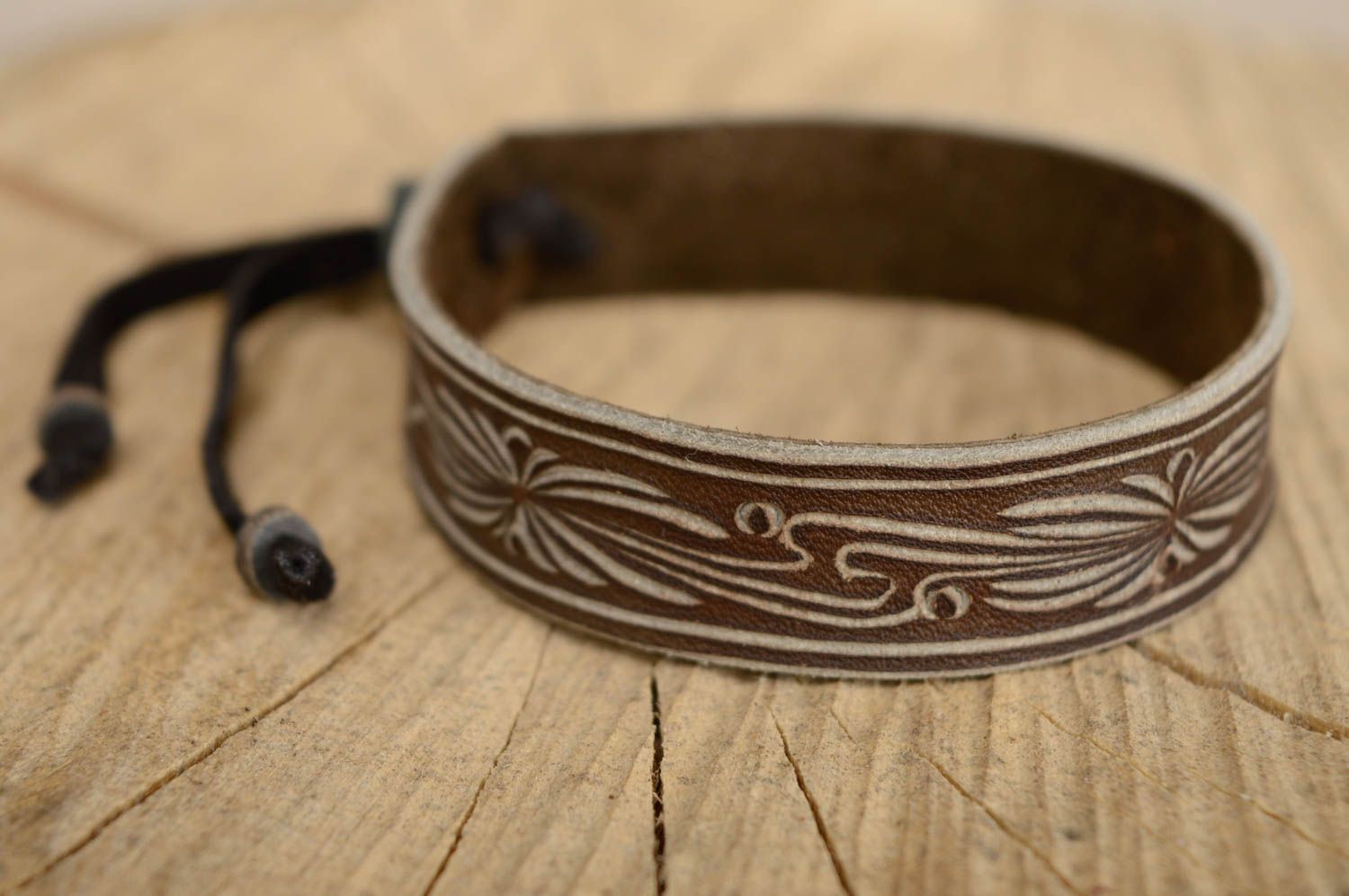 Dark carved leather bracelet photo 1