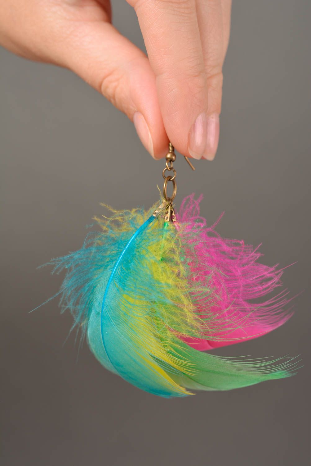 Unusual bright beautiful handmade earrings made of colorful feathers photo 2