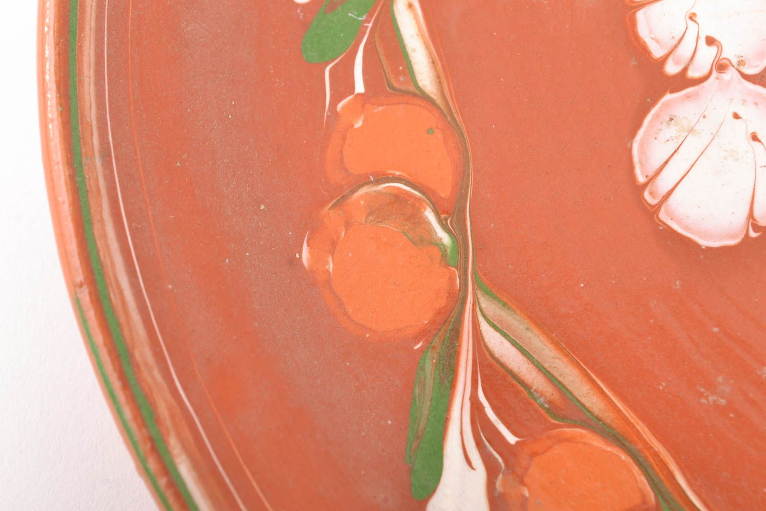 Ceramic plate with ornament made using flyandrovka technique photo 3