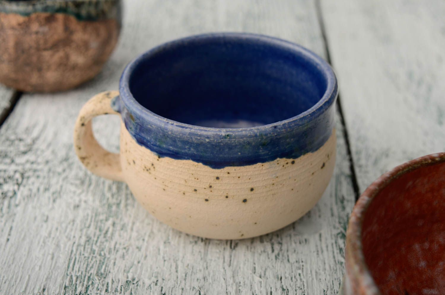 Ceramic glazed inside wide 5 oz coffee cup in beige color outside and dark blue inside photo 2