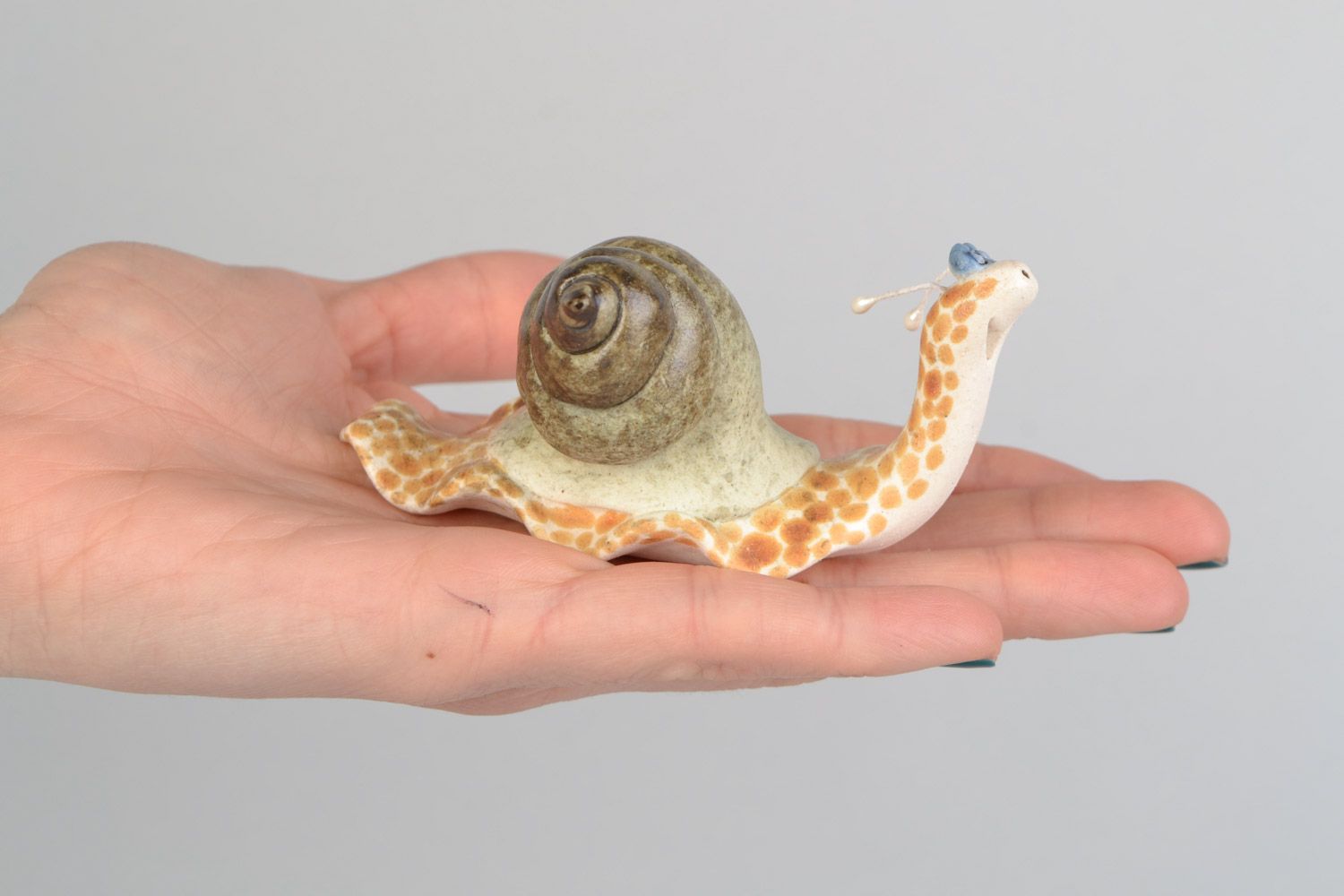 Handmade funny decorative ceramic figurine of smiling snail painted with glaze photo 2