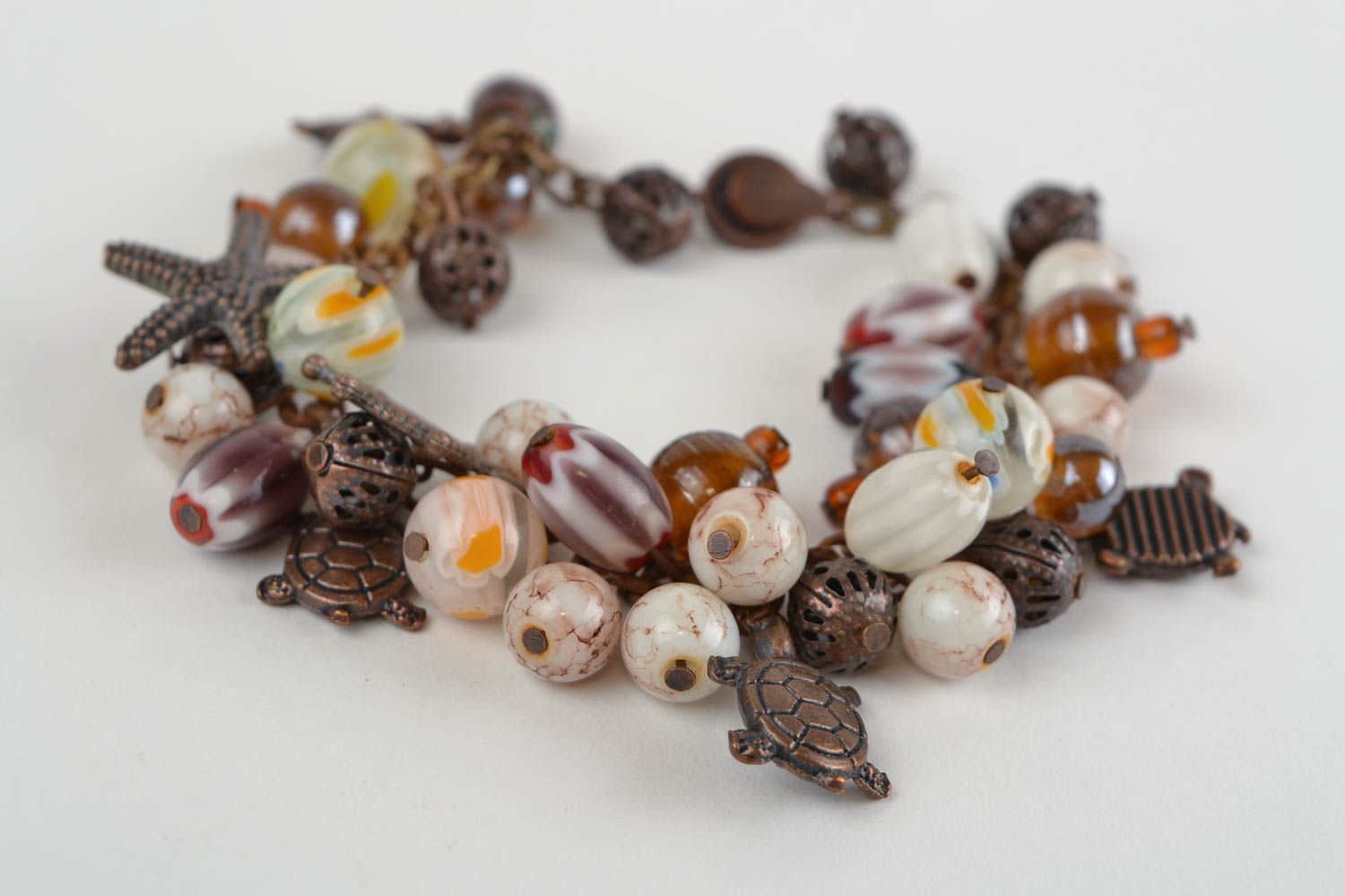 Beautiful handmade wrist bracelet with cat's eye and glass beads in marine style photo 1