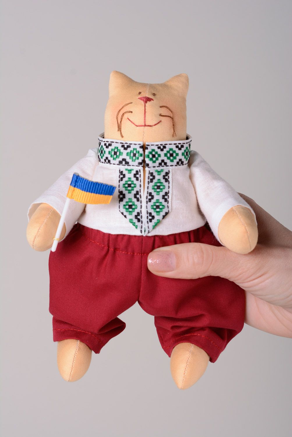Handmade designer soft toy sewn of cotton in a shape of cat in Ukrainian clothes photo 3