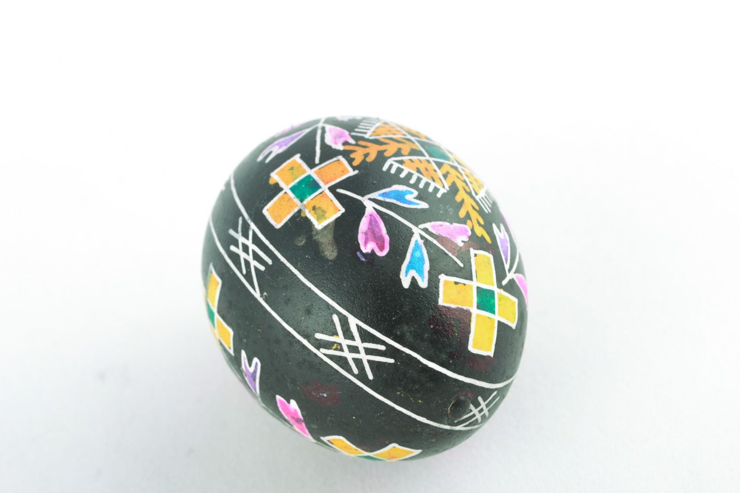 Handmade ornamented Easter egg painted using waxing technique photo 3