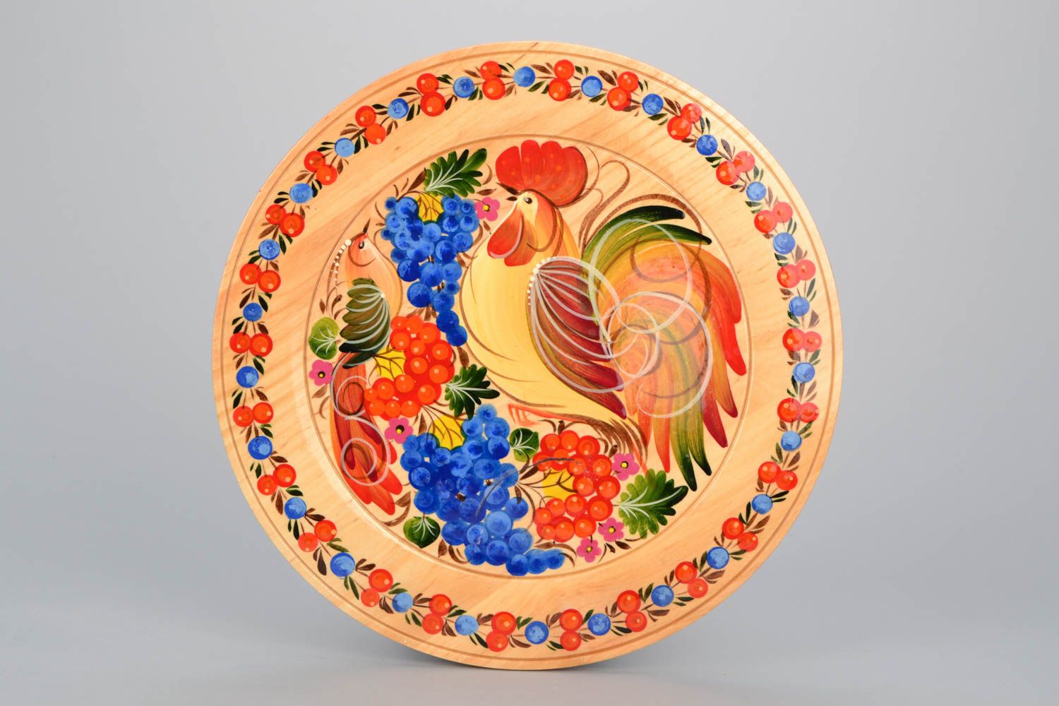 Decorative plate with Petrikivka painting photo 1