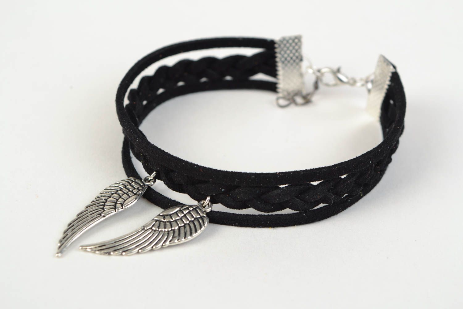 Stylish black handmade suede cord bracelet with metal charms in the shape of wings photo 3