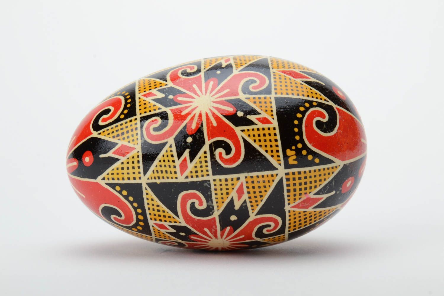 Homemade decorative Easter egg traditional pysanka painted in contrast colors photo 3