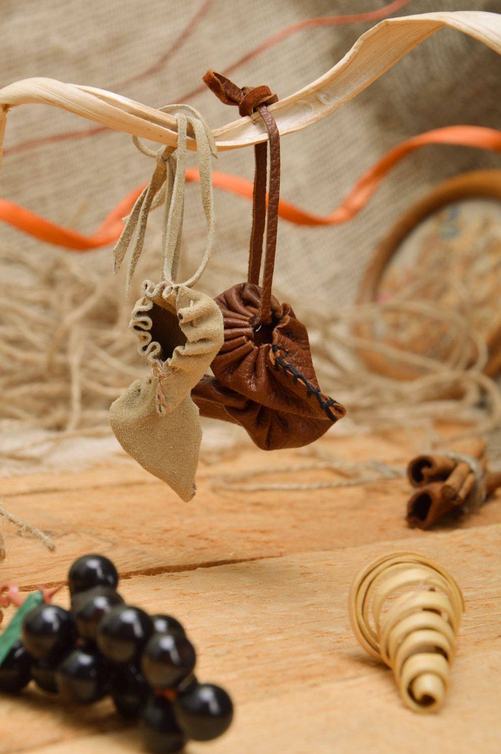 Set of handmade leather keychains 2 items brown key accessories in the shape of bast shoes photo 1