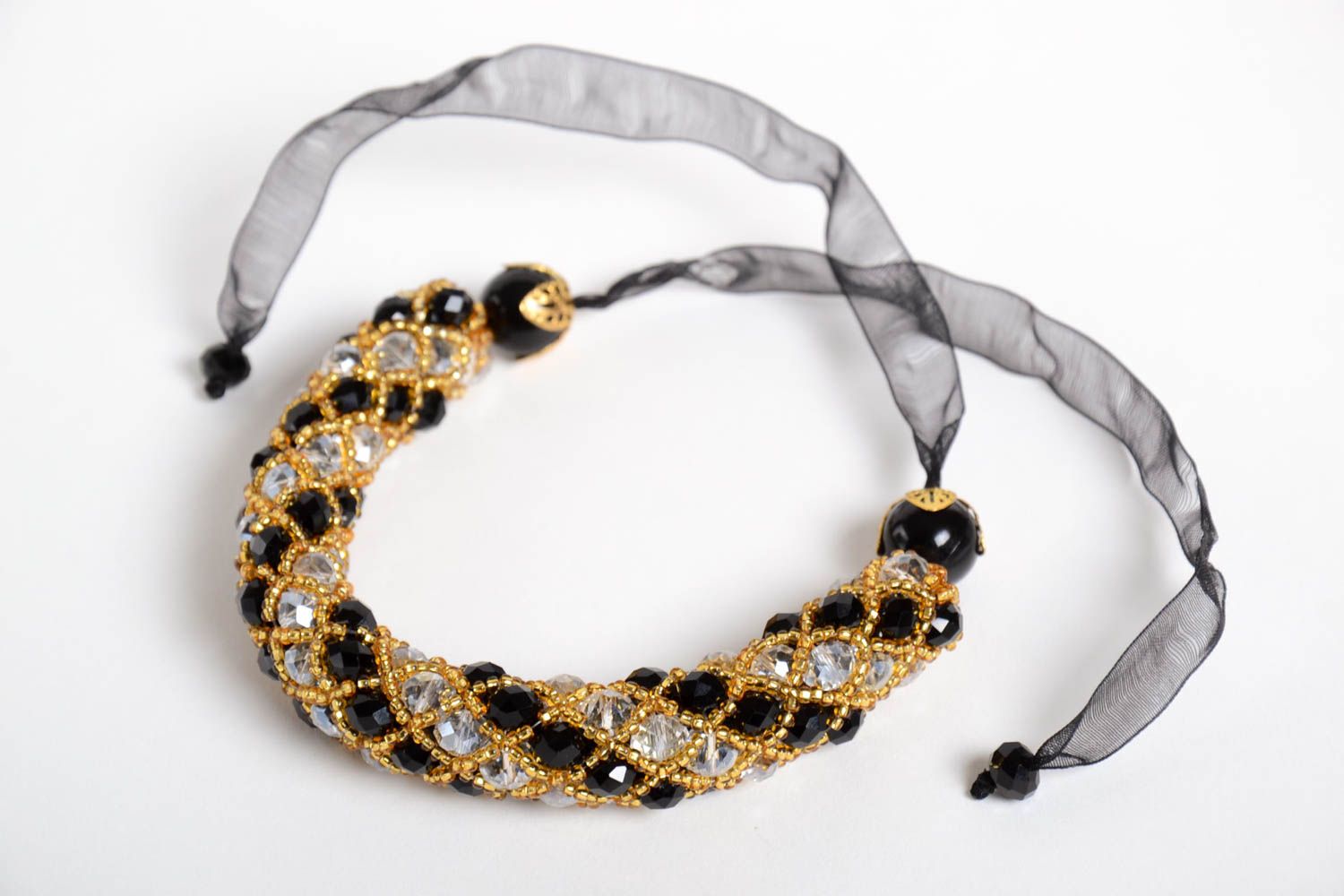 Elegant handmade black and gold color beads large strand bracelet  on a black rope photo 3
