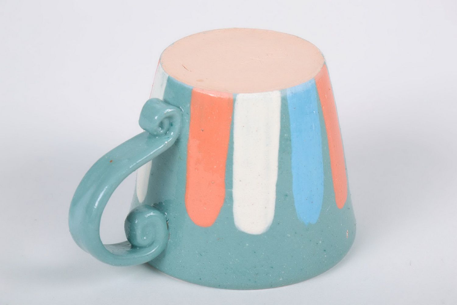 Porcelain cup with handle in blue, white, and orange color photo 3